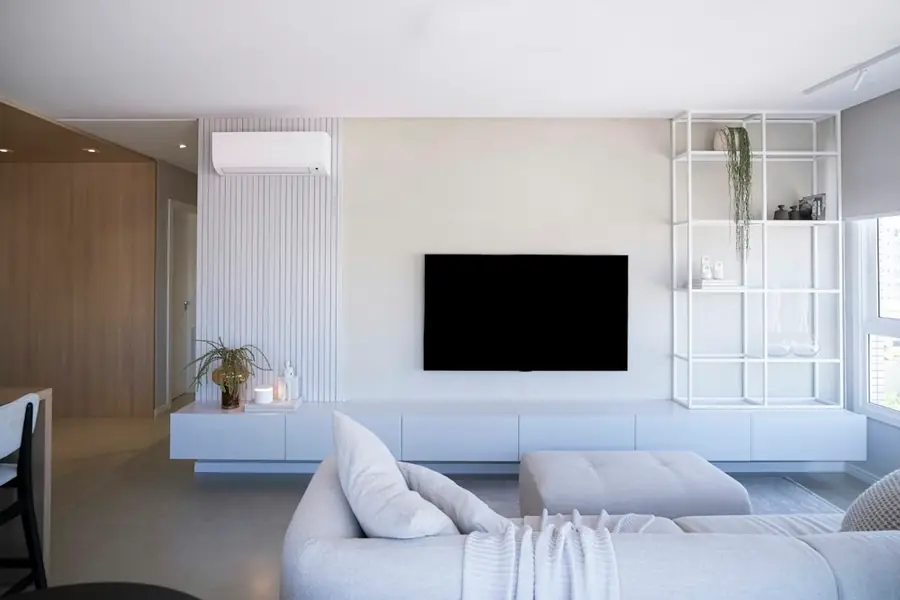 Bright living room with a split system air conditioner above the TV
